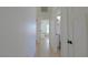 Hallway with doors leading to different rooms, with light colored wood-look flooring at 1660 W Princeton Cir, Pahrump, NV 89060