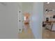 Hallway with wood-look floors that transitions to a bedroom, living room and bathroom at 1660 W Princeton Cir, Pahrump, NV 89060