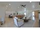 Open concept living room and kitchen area with island, dining, and stainless steel appliances at 1660 W Princeton Cir, Pahrump, NV 89060