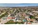 Aerial view of neighborhood with mountain views in background showcasing many single Gathering homes at 167 Ebb Tide Cir, Las Vegas, NV 89123