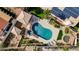 Aerial view of a backyard oasis with pool, spa, sunbathing deck, outdoor seating, and solar at 167 Ebb Tide Cir, Las Vegas, NV 89123
