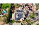 Aerial view of backyard pool, solar panels, and desert landscaping with neighborhood view at 167 Ebb Tide Cir, Las Vegas, NV 89123
