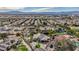 Aerial view of neighborhood with mountain views in background showcasing single Gathering homes and lush landscaping at 167 Ebb Tide Cir, Las Vegas, NV 89123