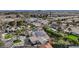 An aerial view shows the residence complete with pool, lush landscaping, and solar panels for energy efficiency at 167 Ebb Tide Cir, Las Vegas, NV 89123