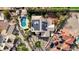 An aerial view of the home featuring a pool, solar panels and well-manicured landscaping at 167 Ebb Tide Cir, Las Vegas, NV 89123