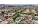 Aerial view of city skyline and mountains in the distance with desert community in foreground at 167 Ebb Tide Cir, Las Vegas, NV 89123