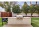 Backyard featuring a built-in grill with a grassy yard at 167 Ebb Tide Cir, Las Vegas, NV 89123