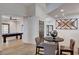 View of bar area leading to game room with pool table, wood floors, and modern design at 167 Ebb Tide Cir, Las Vegas, NV 89123