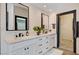Bathroom features double vanity with marble countertop and black hardware at 167 Ebb Tide Cir, Las Vegas, NV 89123