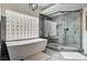 A modern bathroom with a soaking tub and a glass-enclosed shower at 167 Ebb Tide Cir, Las Vegas, NV 89123