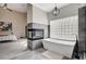 A modern bathroom with a fireplace and a soaking tub at 167 Ebb Tide Cir, Las Vegas, NV 89123