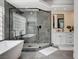Elegant bathroom with soaking tub and glass-enclosed shower, complemented by a bright window at 167 Ebb Tide Cir, Las Vegas, NV 89123
