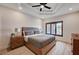 Bedroom boasts dark framed windows, tray ceilings and wood floors at 167 Ebb Tide Cir, Las Vegas, NV 89123