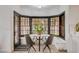 Corner breakfast nook with bay windows and two chairs at 167 Ebb Tide Cir, Las Vegas, NV 89123