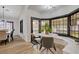 Breakfast nook with bay windows connects to the dining room table at 167 Ebb Tide Cir, Las Vegas, NV 89123