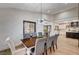 Dining room with views of kitchen and secondary dining area, modern lighting and ample seating at 167 Ebb Tide Cir, Las Vegas, NV 89123