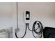 Garage wall featuring an installed electric vehicle (EV) charger at 167 Ebb Tide Cir, Las Vegas, NV 89123