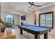 Beautifully decorated game room with a pool table, a fireplace, and modern lighting at 167 Ebb Tide Cir, Las Vegas, NV 89123