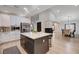 Open-concept kitchen boasts stainless appliances, an island with countertop seating, and access to a dining space at 167 Ebb Tide Cir, Las Vegas, NV 89123
