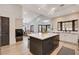 Modern kitchen with stainless appliances, an island with countertop seating, and white cabinetry at 167 Ebb Tide Cir, Las Vegas, NV 89123