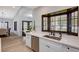 Kitchen with white cabinetry and view to breakfast nook at 167 Ebb Tide Cir, Las Vegas, NV 89123