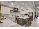 Modern kitchen with white cabinetry, stainless steel appliances, and a large center island at 167 Ebb Tide Cir, Las Vegas, NV 89123
