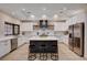 Bright kitchen with white cabinets, stainless steel appliances, and large island with seating at 167 Ebb Tide Cir, Las Vegas, NV 89123