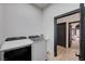 Laundry room features side-by-side washer and dryer near doorway at 167 Ebb Tide Cir, Las Vegas, NV 89123
