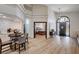 Open-concept living area boasts wood-look floors, modern lighting, and access to the Primary bedroom at 167 Ebb Tide Cir, Las Vegas, NV 89123
