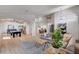 Open-concept living room with hardwood floors and sightlines to dining and game rooms at 167 Ebb Tide Cir, Las Vegas, NV 89123