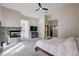 A spacious main bedroom with a fireplace, TV, and backyard access at 167 Ebb Tide Cir, Las Vegas, NV 89123