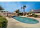 Sparkling pool with an outdoor kitchen, gazebo, solar panels and desert landscaping at 167 Ebb Tide Cir, Las Vegas, NV 89123