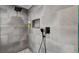 Modern shower features gray tile, a rainfall shower head and handheld sprayer at 167 Ebb Tide Cir, Las Vegas, NV 89123
