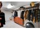 Large walk-in closet with custom shelving and a chest of drawers at 167 Ebb Tide Cir, Las Vegas, NV 89123