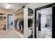 Spacious walk-in closet with custom shelving and an open doorway at 167 Ebb Tide Cir, Las Vegas, NV 89123