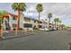 Multi-unit building with desert landscaping and ample parking, showcasing community living at 1701 E Katie Ave # 51, Las Vegas, NV 89119