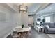 Cozy dining area near living room with decorative lighting and access to hall and kitchen at 1701 E Katie Ave # 51, Las Vegas, NV 89119