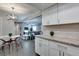 Bright kitchen with stainless appliances, granite countertops, and an adjacent dining area and living room at 1701 E Katie Ave # 51, Las Vegas, NV 89119