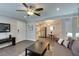 Comfortable living room with ceiling fan and stylish decor, looking into dining area and stainless steel kitchen at 1701 E Katie Ave # 51, Las Vegas, NV 89119