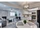 Bright, open-concept living room featuring a fireplace and a seamless flow into the modern kitchen at 1701 E Katie Ave # 51, Las Vegas, NV 89119