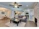 Spacious living room view with fireplace, mirrored wall, leading to the dining area and kitchen at 1701 E Katie Ave # 51, Las Vegas, NV 89119