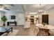 Living space with fireplace leads to the kitchen with stainless steel appliances and seating at 1701 E Katie Ave # 51, Las Vegas, NV 89119