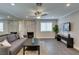 Comfortable living space features a stylish fireplace, a ceiling fan, and ample room at 1701 E Katie Ave # 51, Las Vegas, NV 89119
