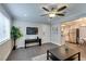 Bright living room with large window, ceiling fan, and view of the kitchen and dining area at 1701 E Katie Ave # 51, Las Vegas, NV 89119