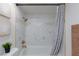 Well-lit bathroom featuring a shower/tub with white marble-look tiling and brushed gold fixtures at 1701 E Katie Ave # 68, Las Vegas, NV 89119