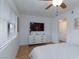 Bright bedroom featuring a TV on a dresser, a window with blinds, and clean, white walls at 1701 E Katie Ave # 68, Las Vegas, NV 89119