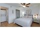 Bedroom featuring a convenient laundry area, closet, comfortable bed, and modern decor at 1701 E Katie Ave # 68, Las Vegas, NV 89119