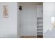 Organized closet with shelves and hanging rods, providing ample storage space in the bedroom at 1701 E Katie Ave # 68, Las Vegas, NV 89119