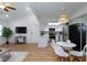 Open floor plan with a dining table, stainless steel fridge, and living room at 1701 E Katie Ave # 68, Las Vegas, NV 89119