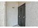 Close-up of a metal security door with decorative scrollwork and unit number at 1701 E Katie Ave # 68, Las Vegas, NV 89119